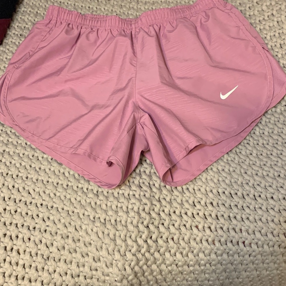 Pink Nike running shorts with zip up back pocket